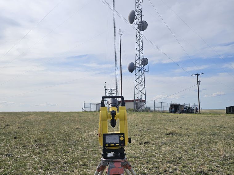 Total station set up on a tower site for survey