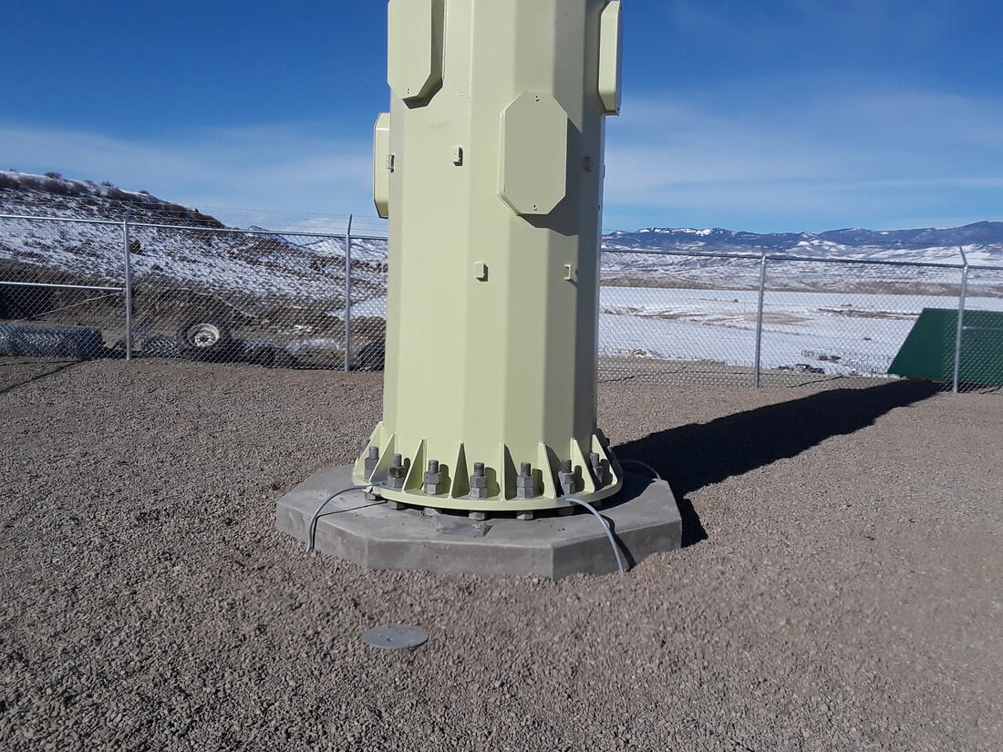 Monopole base flange bolted to its foundation pier