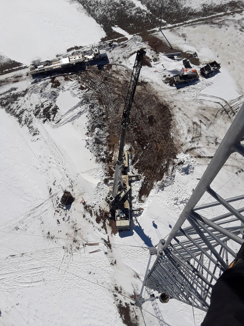 View from the tower down onto the crane and compound in snow