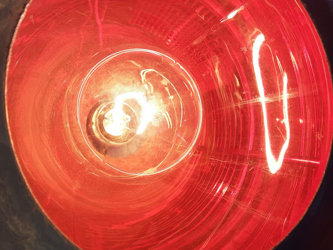 Close view of a lit red obstruction beacon